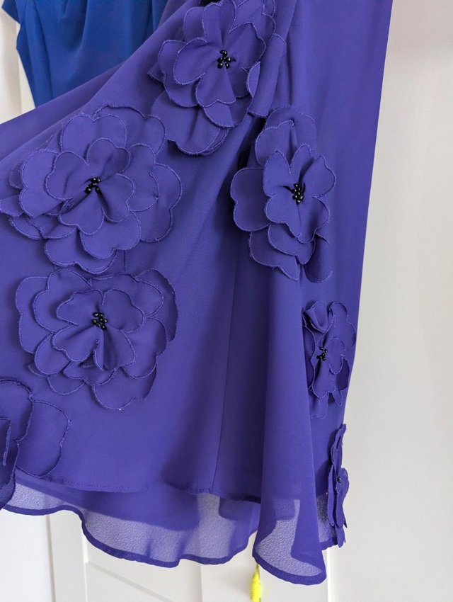 Beautiful Blue party dress with decorative flowers