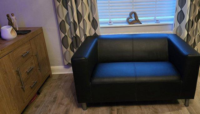 Preview of the first image of Argos faux leather black sofa.
