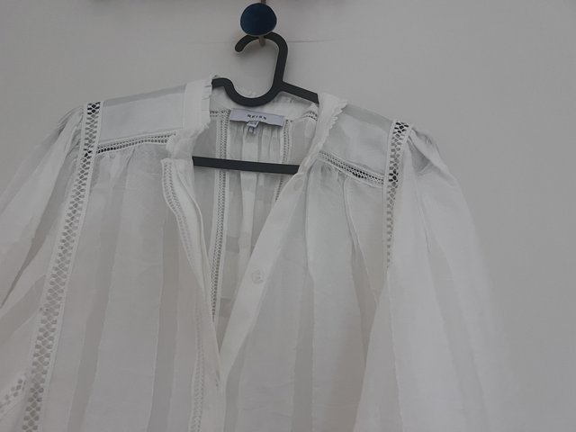 Preview of the first image of Reiss White Broderie Dress.