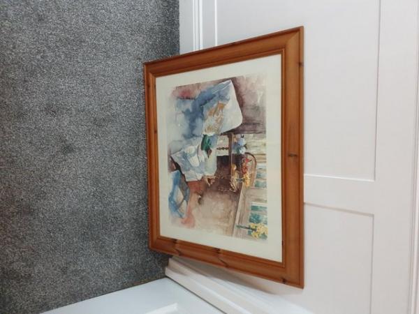 Image 1 of Armchair in window picture in wooden frame