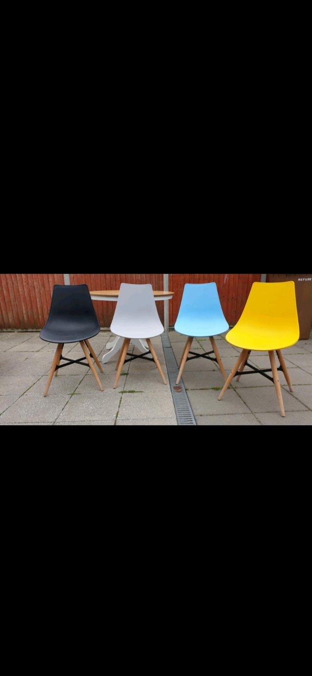 Preview of the first image of Colourful modern dining chairs x 4.