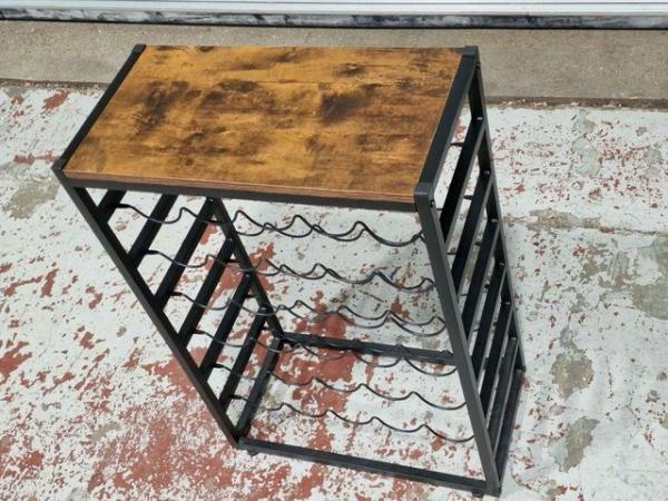 Image 1 of One Wood and Black Metal Wine rack in good condition.