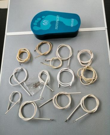 Image 1 of A Tin of 14 Net Curtain Wires of Various Lengths.