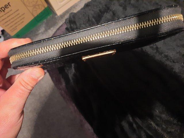 Preview of the first image of Ladies river island purse.