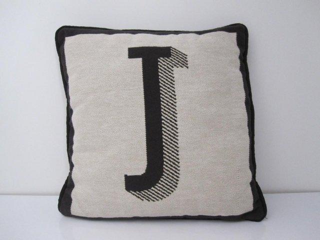 Preview of the first image of Square cushion with letter J on.