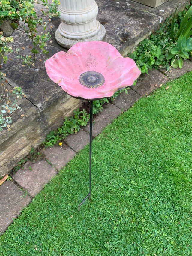 Preview of the first image of Charming cast iron poppy bird feeder.