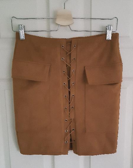 Preview of the first image of Lovely Ladies Ochre Mini Skirt - Size S.