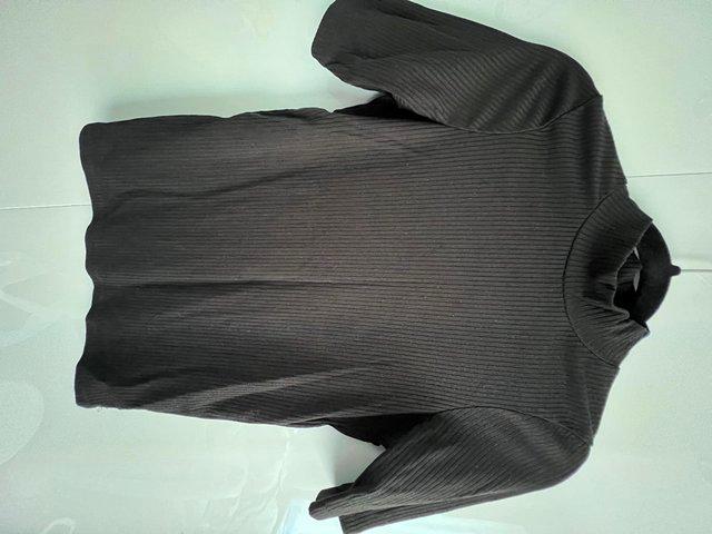 Preview of the first image of Black high neck ribbed top size 6.