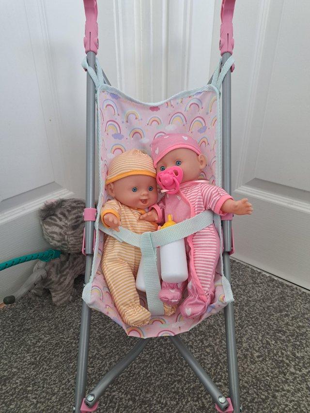 Preview of the first image of Baby pram with 2baby dolls.