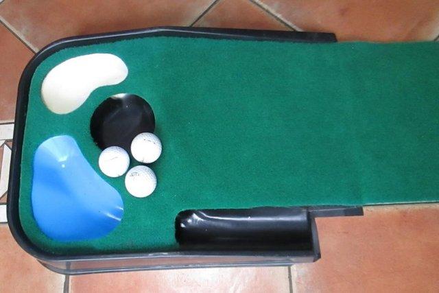 Preview of the first image of Masters Deluxe Hazard Putting Mat, Putter and Balls.