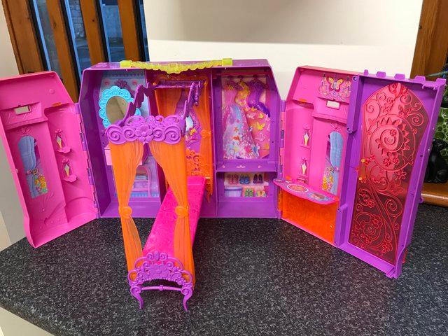Preview of the first image of Barbie car, Barbie Doll , Barbie carry house (opens up).