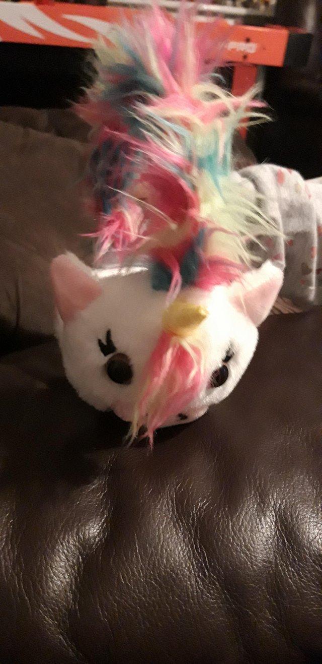 Preview of the first image of Unicorn Fluffy Ear muffs like new.