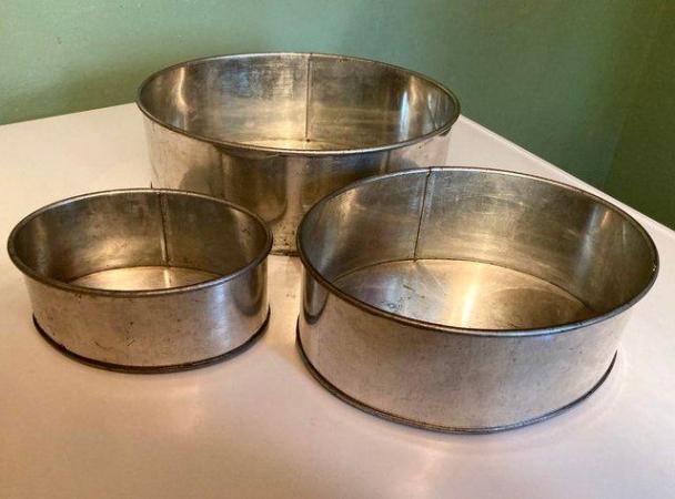 Image 1 of Three oval graded cake tins suitable for tiered cakes