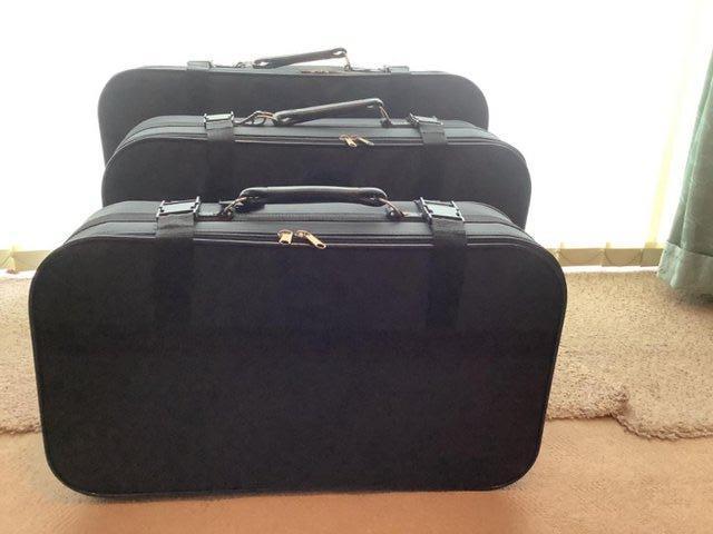 Preview of the first image of Nest of three suitcases - black.