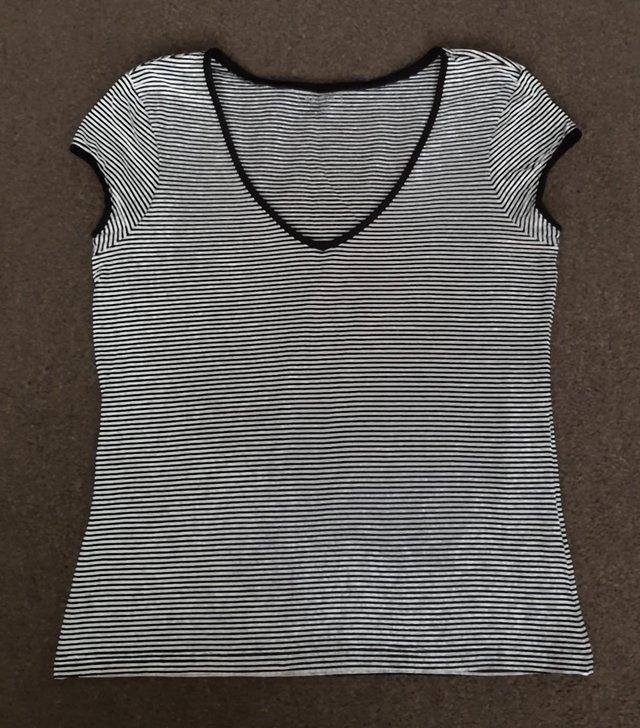 Preview of the first image of Ladies Black/White Stripe V Neck Top - Size 16.