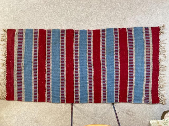 Preview of the first image of Hand woven wool rug in red, blue & grey 150 x 75cm + tassels.
