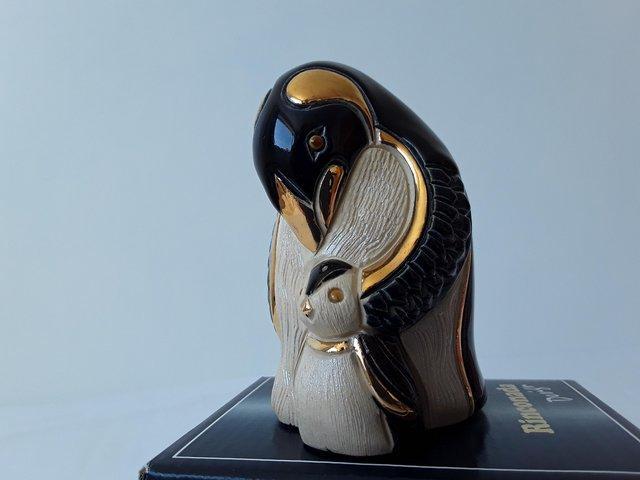Preview of the first image of ARTESANIA RINCONADA SILVER ANNIVERSARY PENGUIN WITH CHICK.