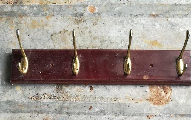 Preview of the first image of Stained Wood Four Hook Coat Rack.