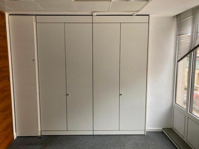Preview of the first image of Lockable 4 door white office tall double cupboards/storage.