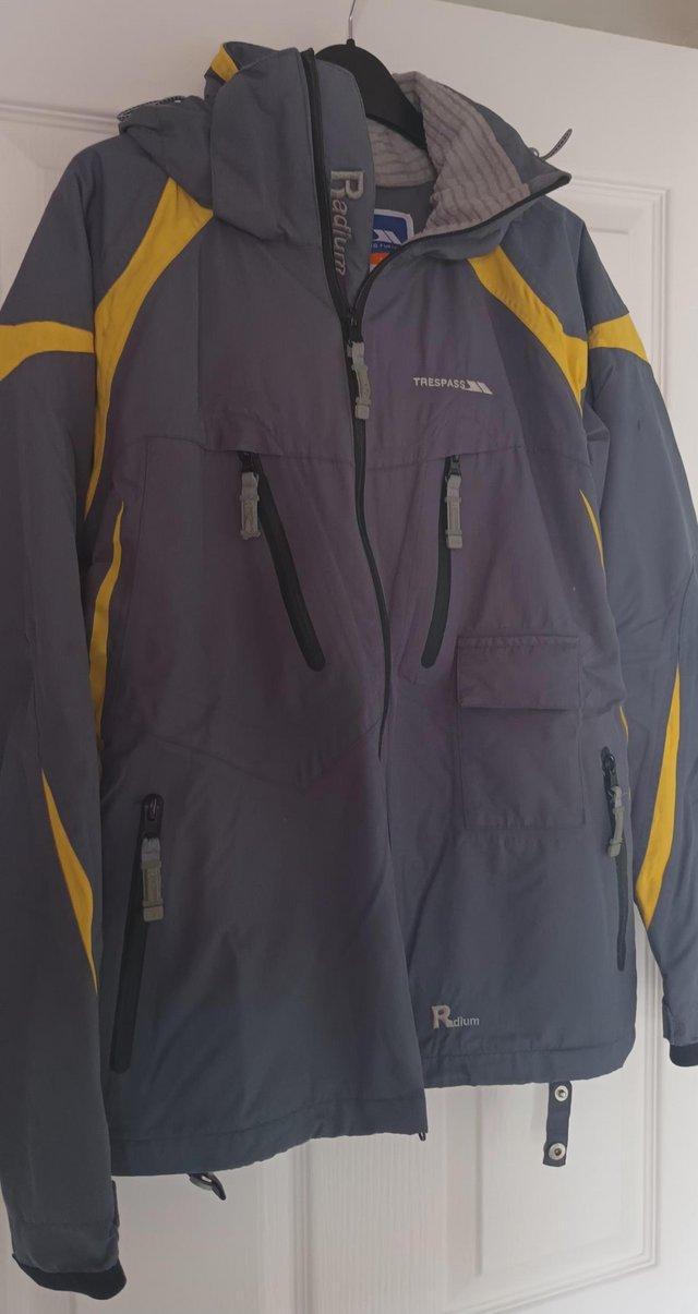 Preview of the first image of Trespass Grey and yellow Skiing Jacket.