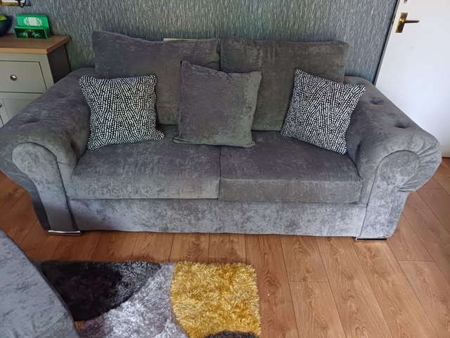 Preview of the first image of 3 seater grey Chesterfield sofa.