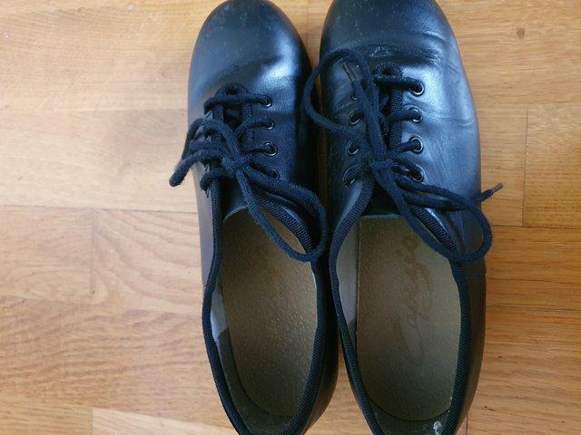 Preview of the first image of Capezio size 4/37 black tap shoes.
