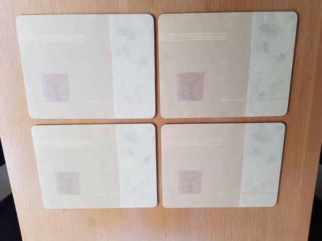 Preview of the first image of Twelve Beige Patterned Table Mats.