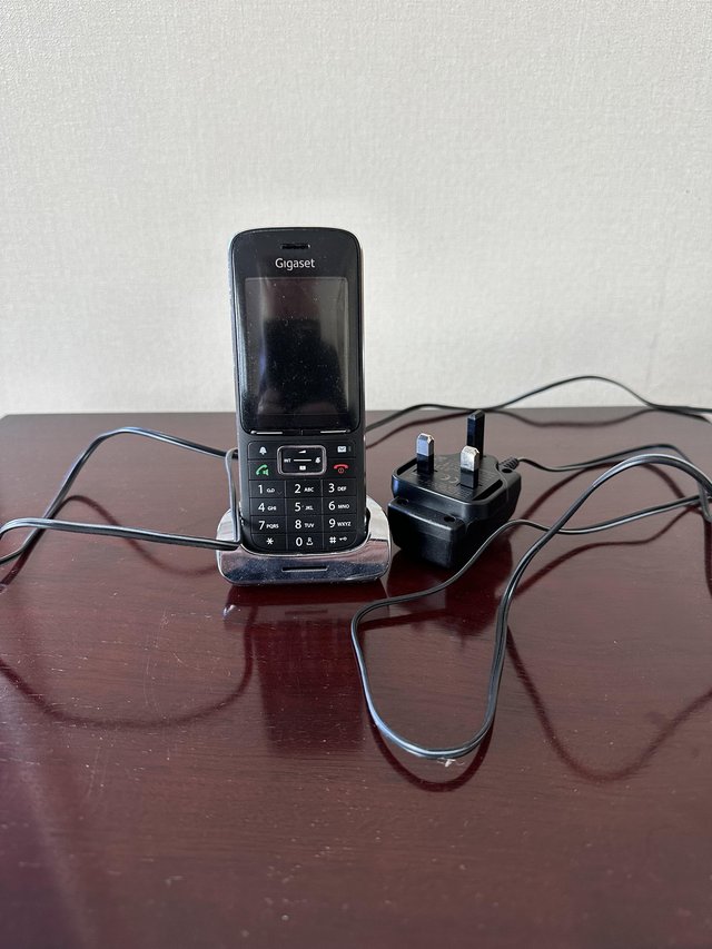 Preview of the first image of Gigaset SL450A Go Black edition landline phone.