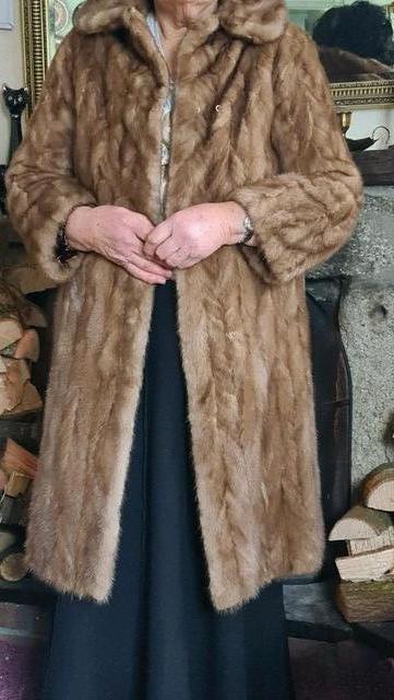 Preview of the first image of Vintage Fur Coat Lined with a Rich Complimentary Satin.