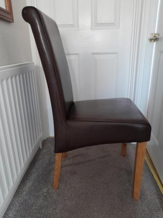 Image 1 of Oakfurnitureland brown leather dining room chairs as new