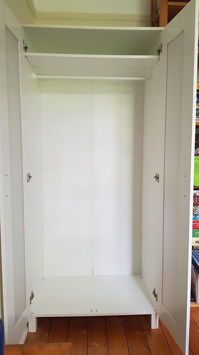 Preview of the first image of IKEA single white wardrobe.