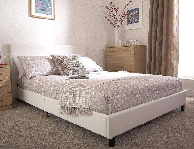 Preview of the first image of Double white faux leather bed in a box bedstead.