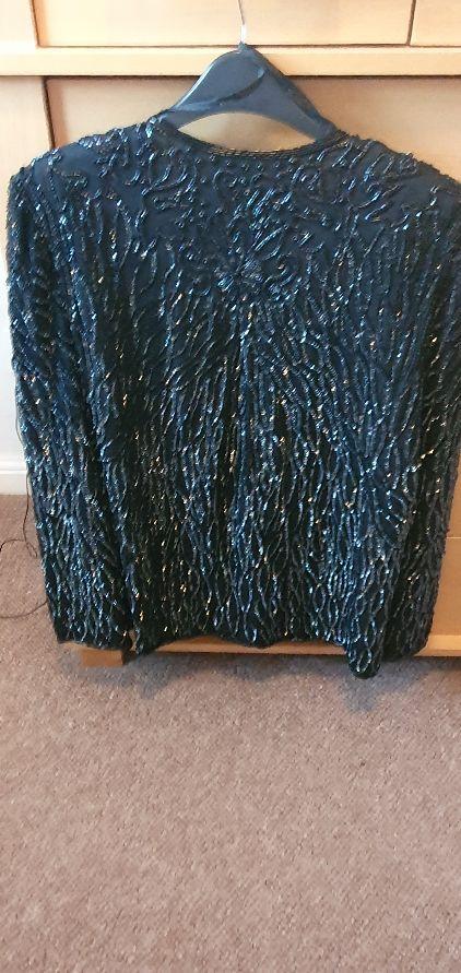 Preview of the first image of Vintage  fully beaded black evening jacket.