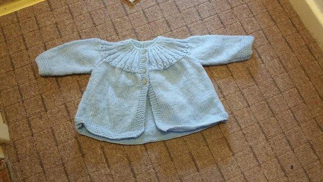 Preview of the first image of Baby boy blue cardigans for sale handknitted.