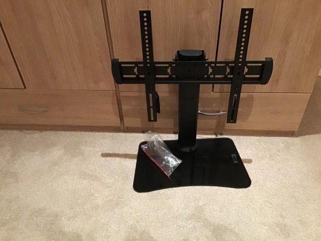 Preview of the first image of Black Metal SMART TV stand with glass base.