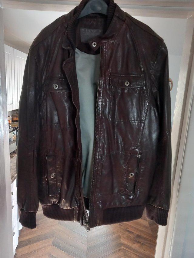 Preview of the first image of Mens brown leather jacket size M.