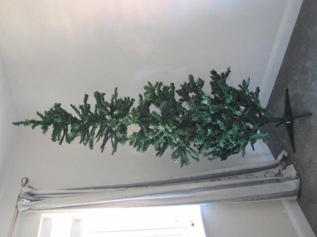Preview of the first image of 7ft artificial green Christmas tree.