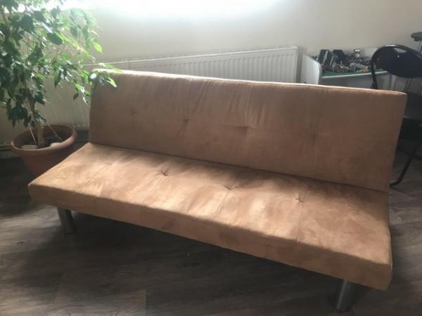 Image 1 of Brown 3 seat sofa bed. Only a few months old