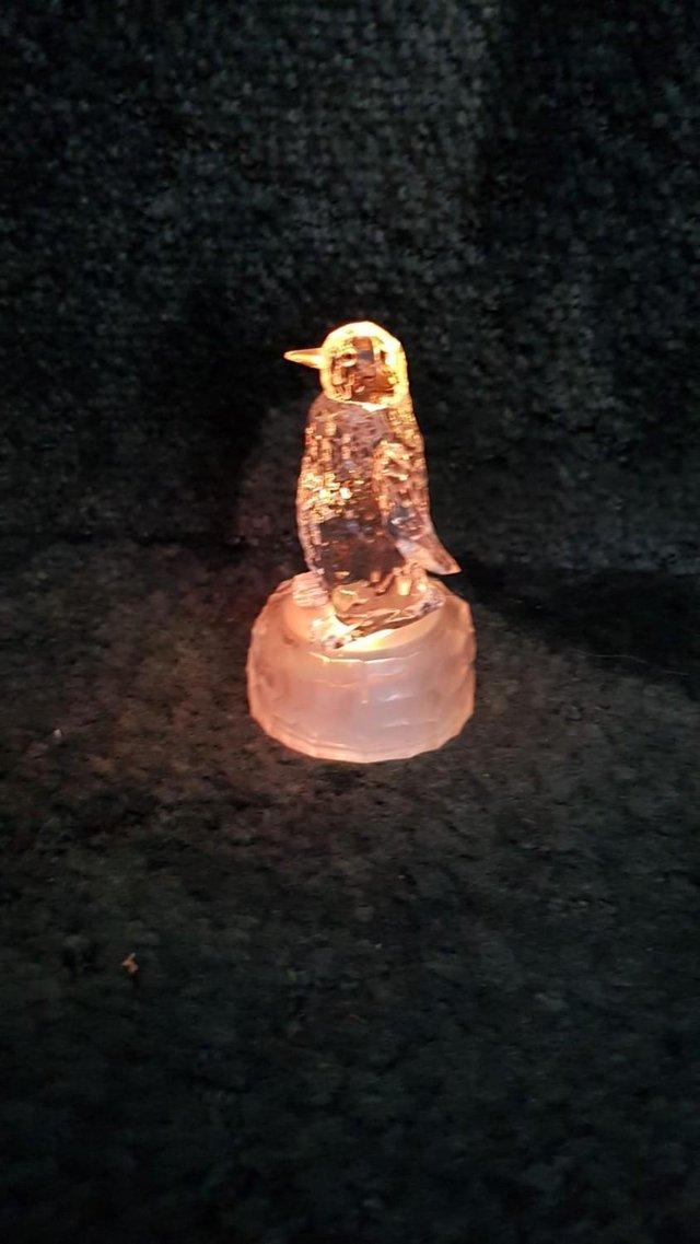 Preview of the first image of Two penguin light up ornaments + spare batteries - Chatham.