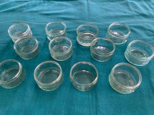 Preview of the first image of Fourteen matching glass ramekin dishes.