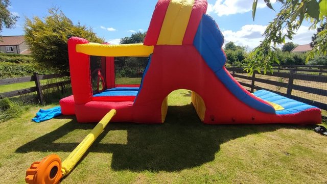 Preview of the first image of HAPPY HOP mega double combo slide bouncy castle.