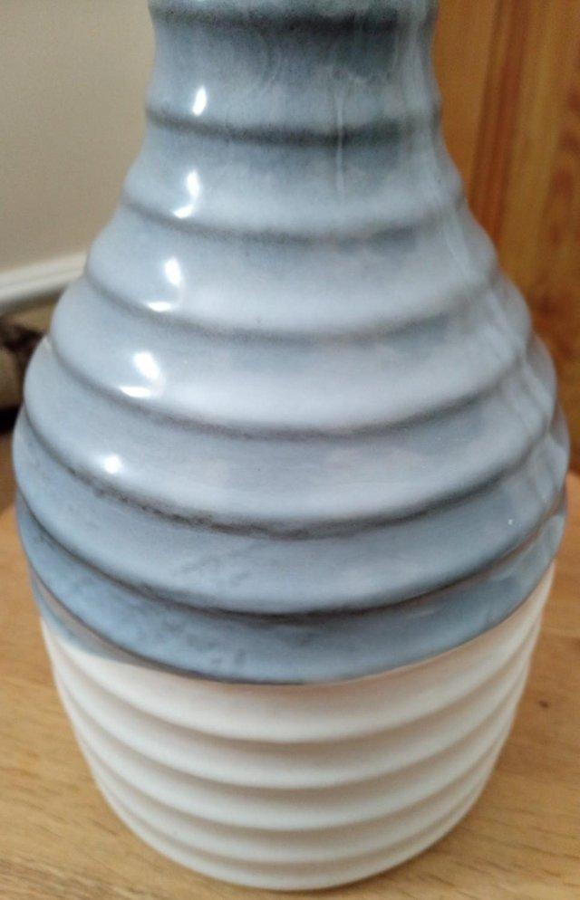 Preview of the first image of Blue ceramic ripple effect tall vase.