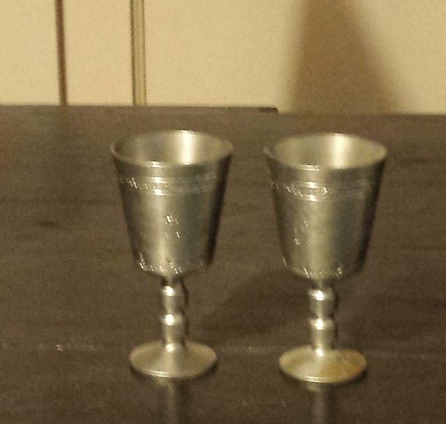 Preview of the first image of Pewter shot glasses - nicely engraved.