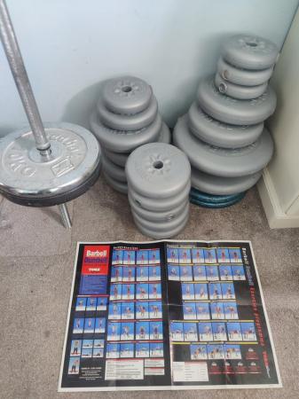 Image 1 of 130kg+ Assortment of weights and a Metal Barbell
