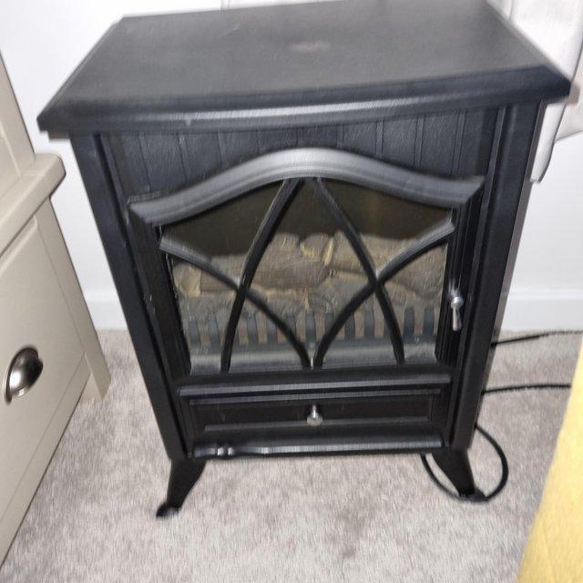 Preview of the first image of BLACK FIRE EFFECT ELECTRIC HEATER.