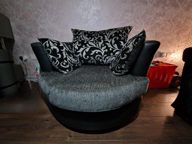 Preview of the first image of Corner sofa and swivel chair with cushions.