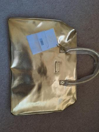 Image 1 of Michael Kors large gold handbag