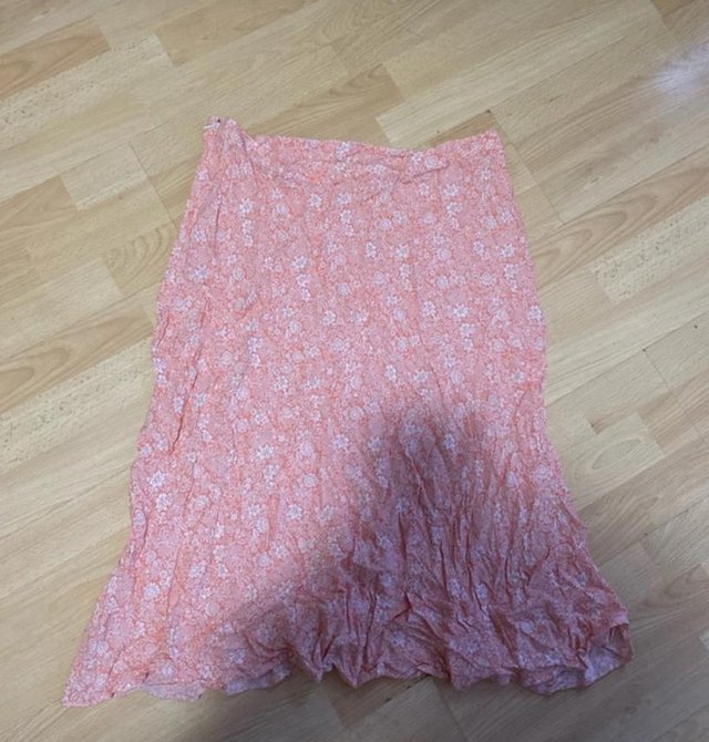 Preview of the first image of Pink floral skirt from feather and bone.