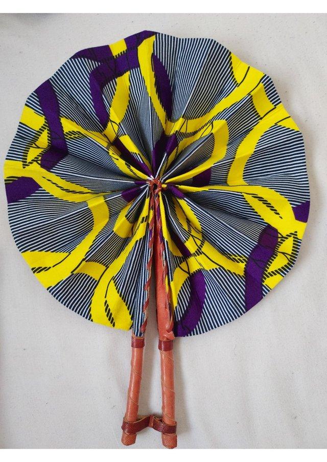 Preview of the first image of Unique handmade yellow fan / accessory with african fabrics.