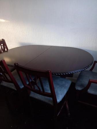 Image 1 of Dark wood dining table with 6 chairs including 2 carvers